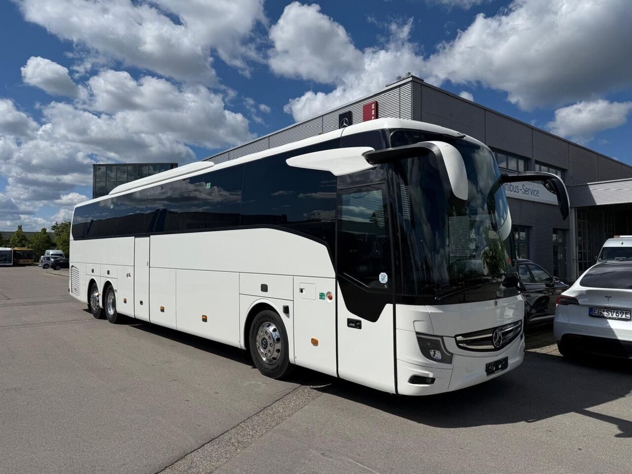 Mercedes Tourismo large coach front and side exterior — 55-57 seats