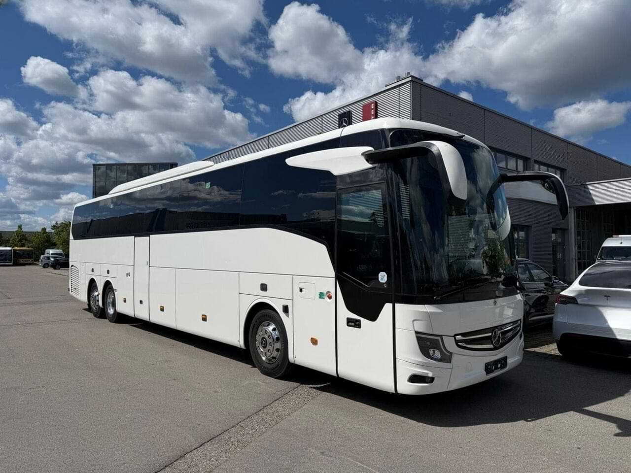 Mercedes Tourismo large coach front and side exterior — 55-57 seats