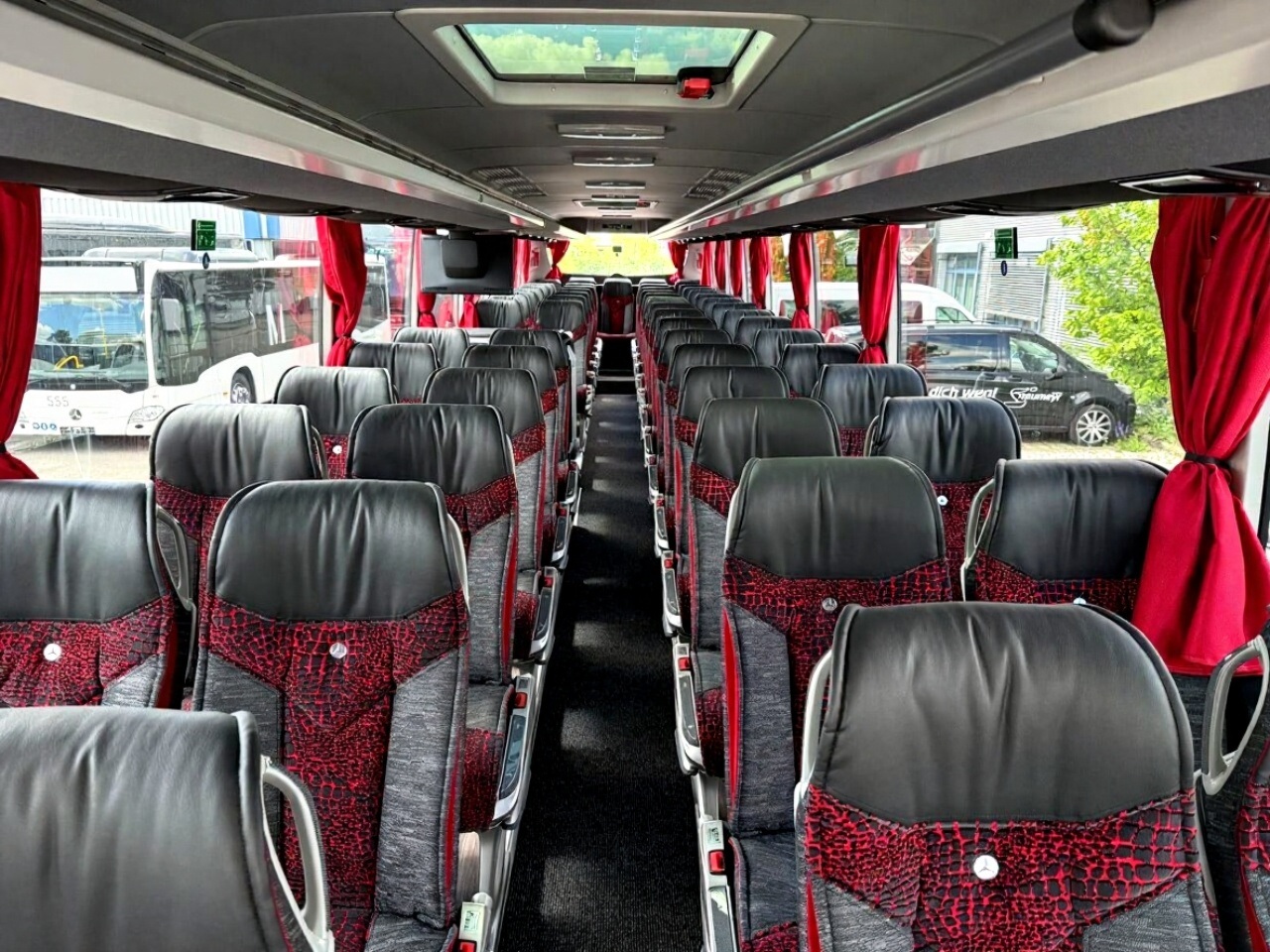 Mercedes Tourismo interior — premium seating for 55-57 passengers
