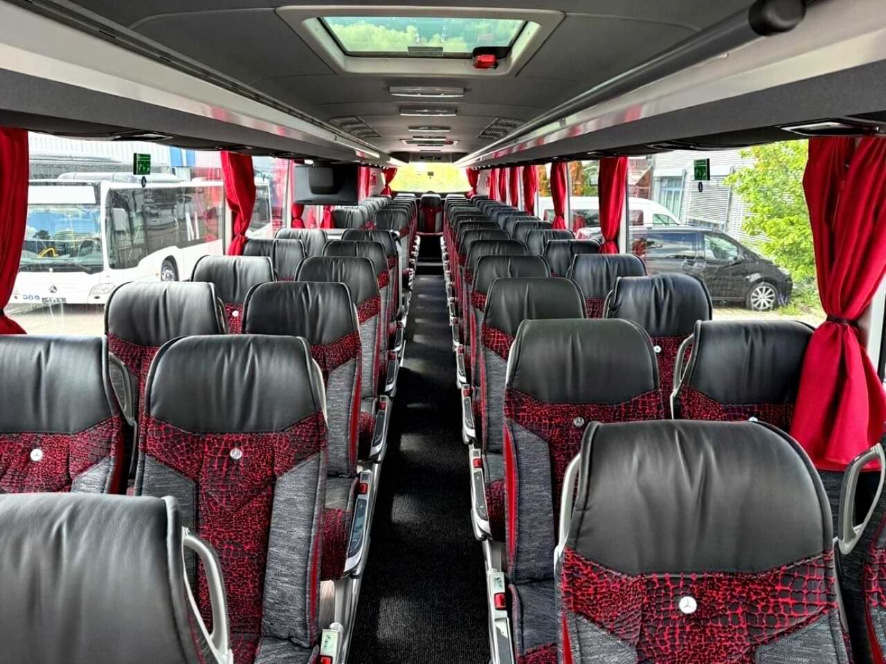 Mercedes Tourismo interior — premium seating for 55-57 passengers